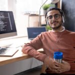 E-commerce web development: building online stores that sell. handsome programmer in headphones listening to mus 2023 11 27 04 56 48 utc